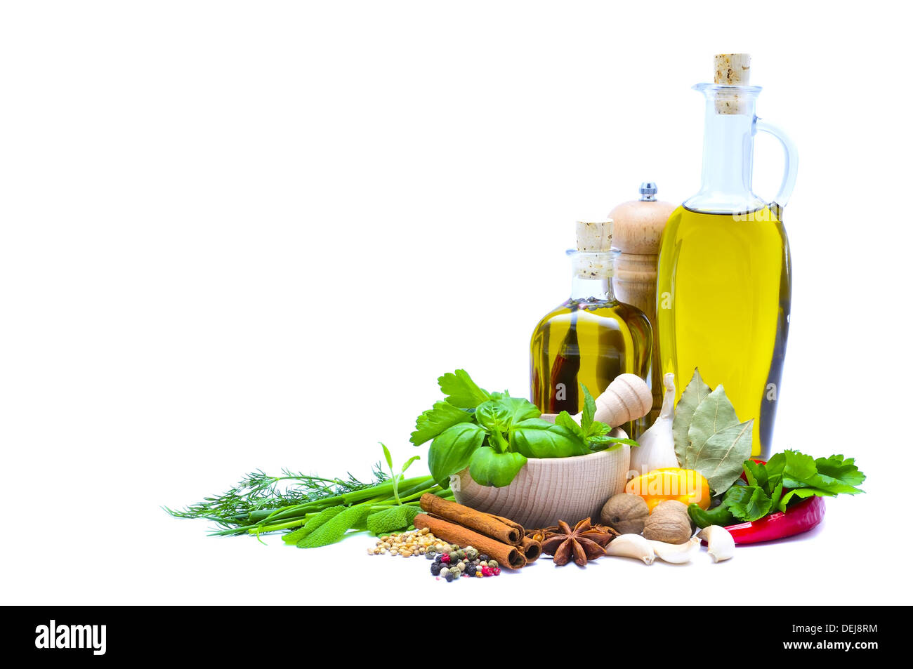 olive oil, herbs and spices isolated on a white background with copy space Stock Photo
