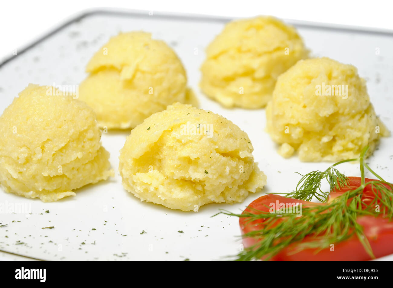 traditional romanian corn meal (mamaliga) on a white plate Stock Photo