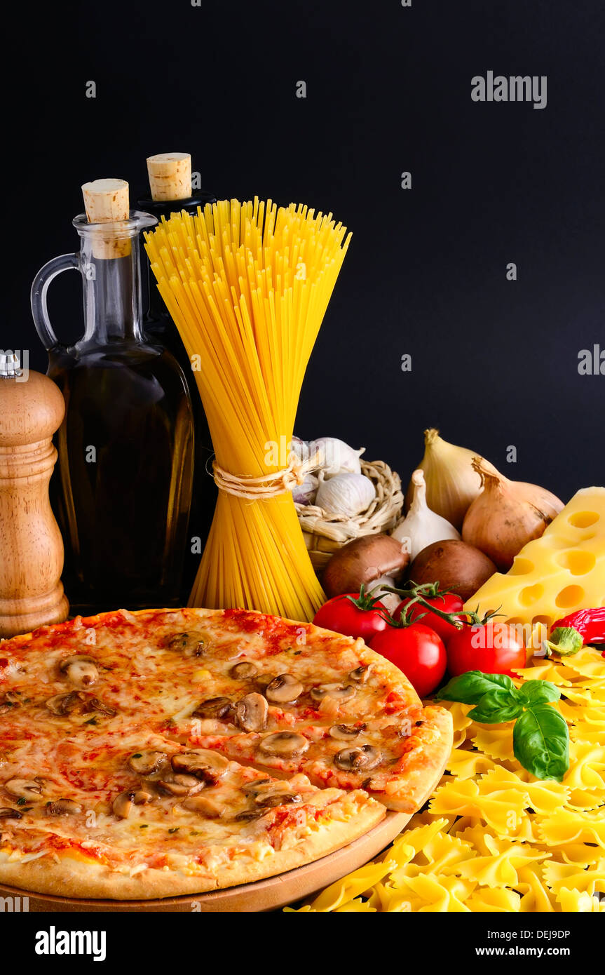 traditional italian food with pizza, pasta and ingredients Stock Photo