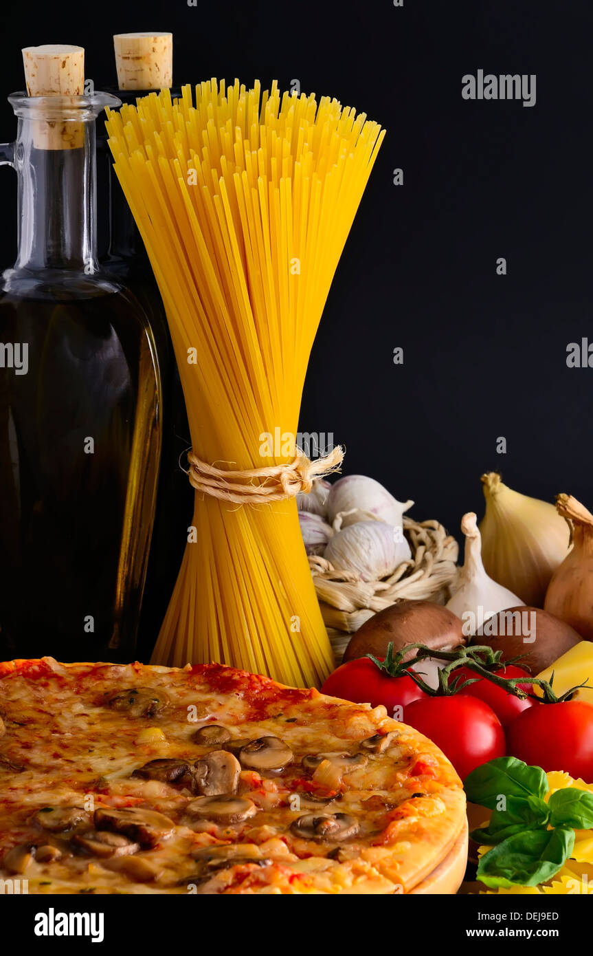 still life with italian pizza, pasta and ingredients Stock Photo