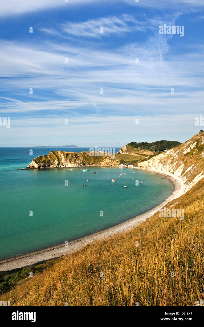 A view of Lulworth Cove, on the Jurassic Coast in Dorset UK photographed on a bright sunny day in September Stock Photo