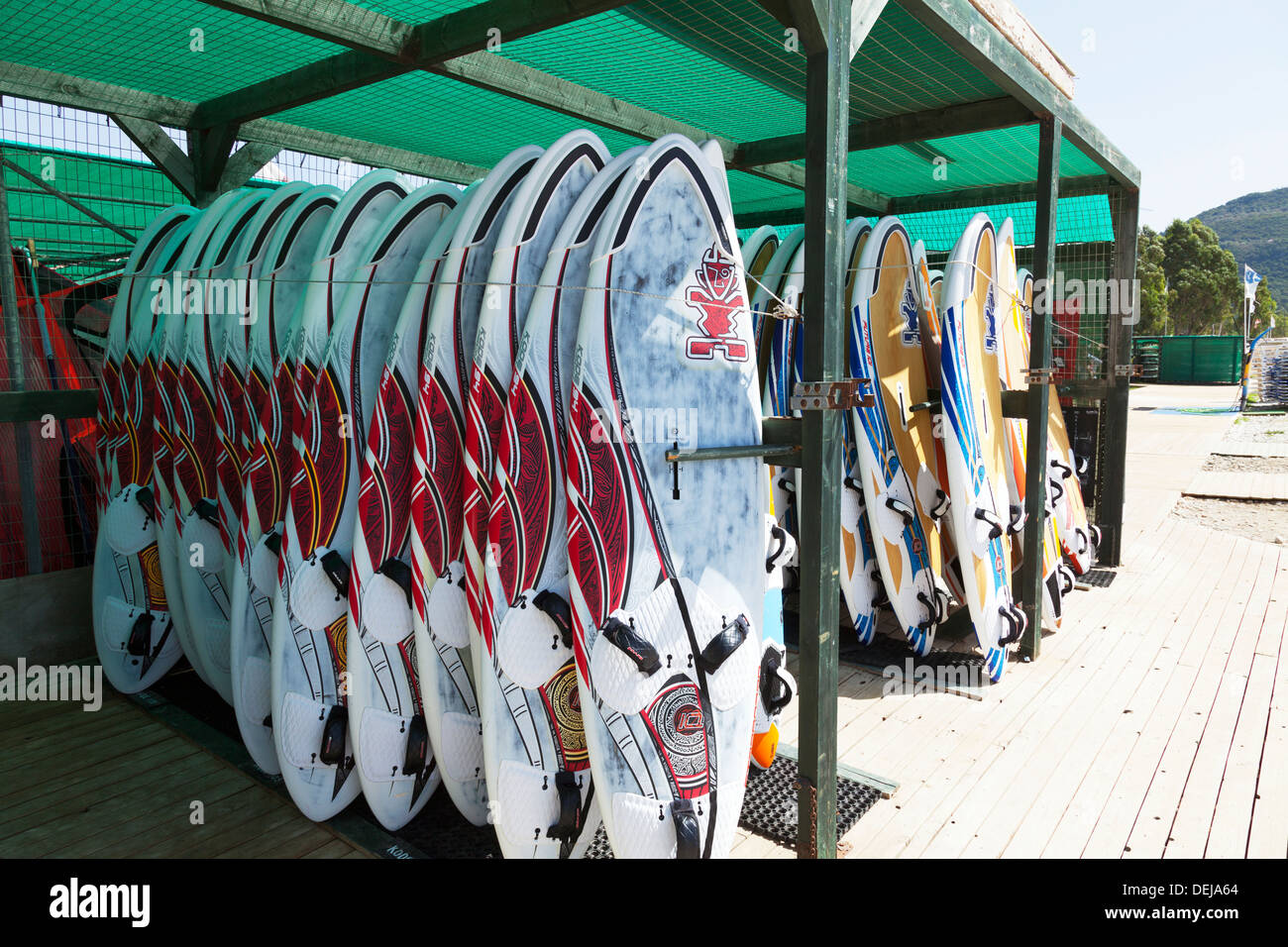 Windsurfing boards lined up for hire Vassiliki Vasiliki Lefkas Lefkada Greek Island Greece Stock Photo