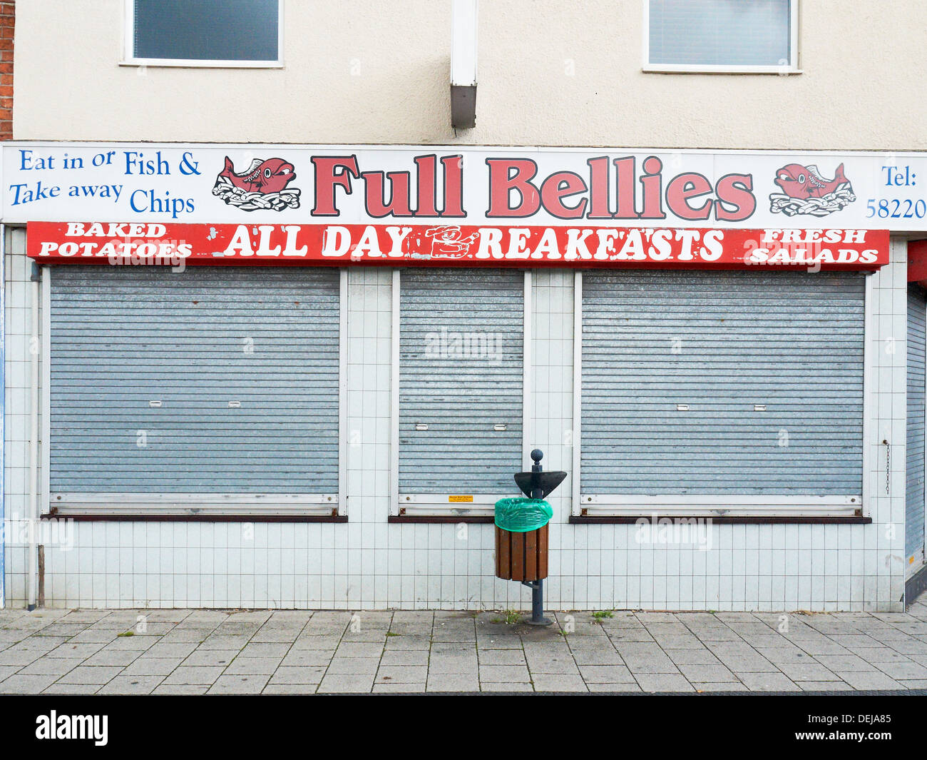 Closed Fish & Chips shop called 'Full Bellies' in Crewe Cheshire UK Stock Photo