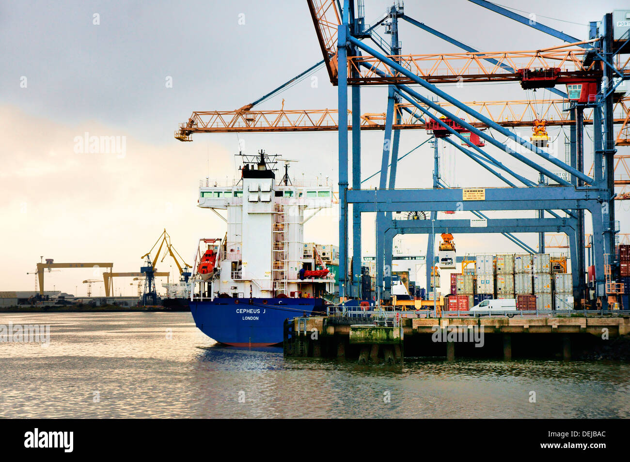 Belfast Harbour, Port of Belfast, Northern Ireland. Container ship dock facility on west bank with Harland and Wolff in distance Stock Photo
