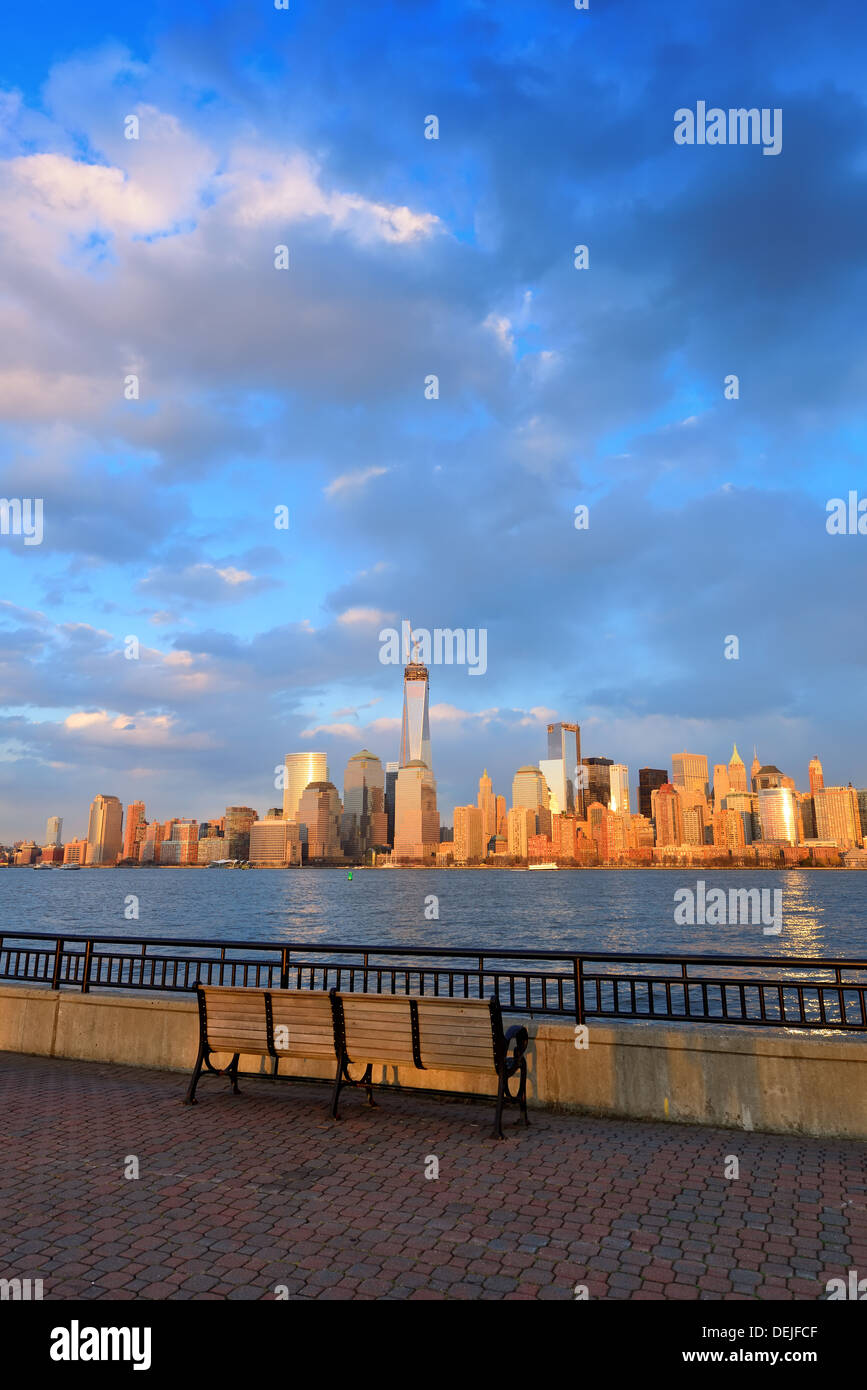 Downtown Manhattan skyline at sunset over Hudson River in New York City ...