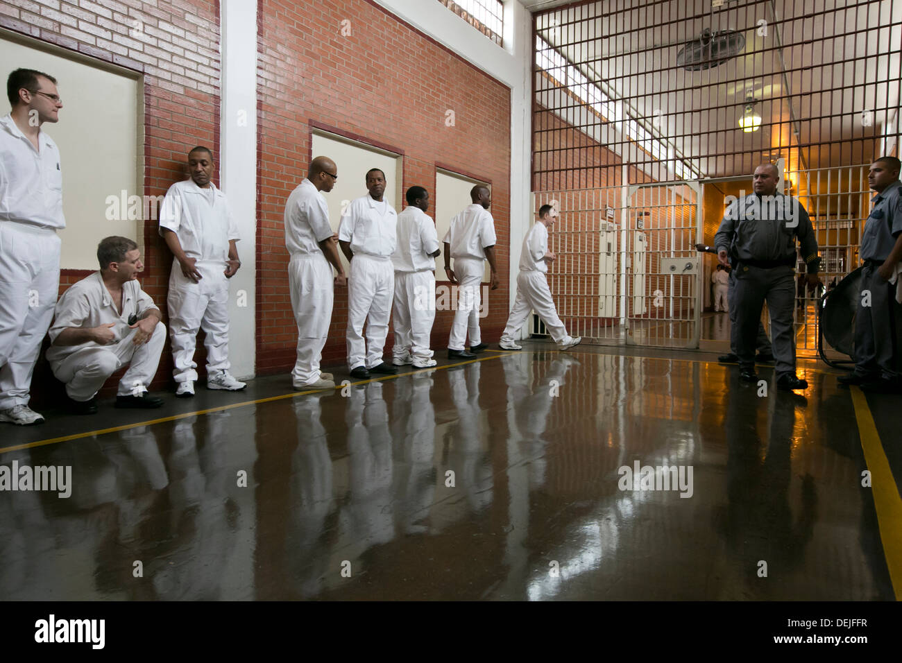 Male inmates at the Darrington Unit near Houston, Texas line up inside prison to attend event. ©MKC/Bob Daemmrich Photography, Inc. Stock Photo