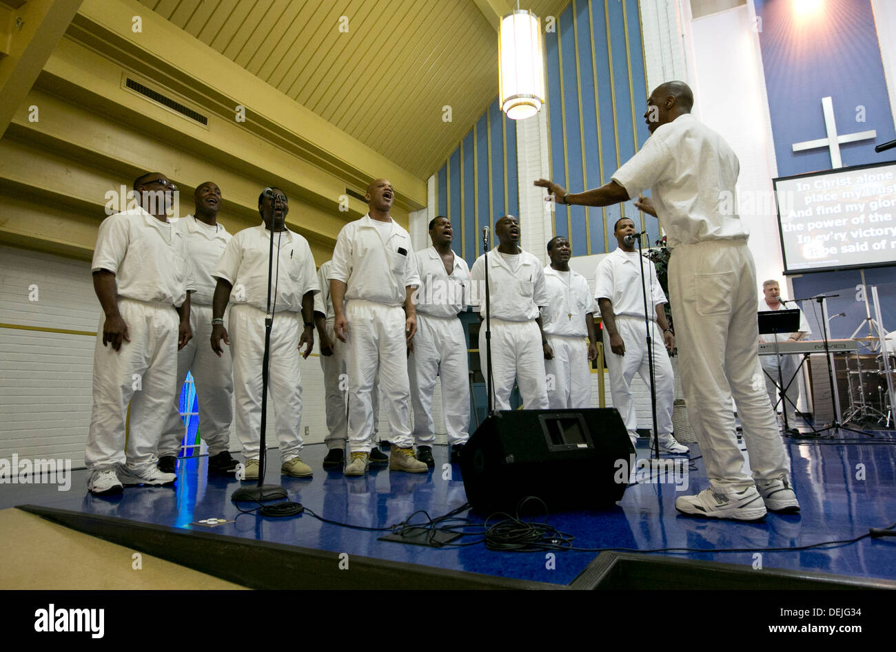 Male members of a prison choir and students at the Darrignton Unit Prison Seminary program perform during a convocation ceremony Stock Photo