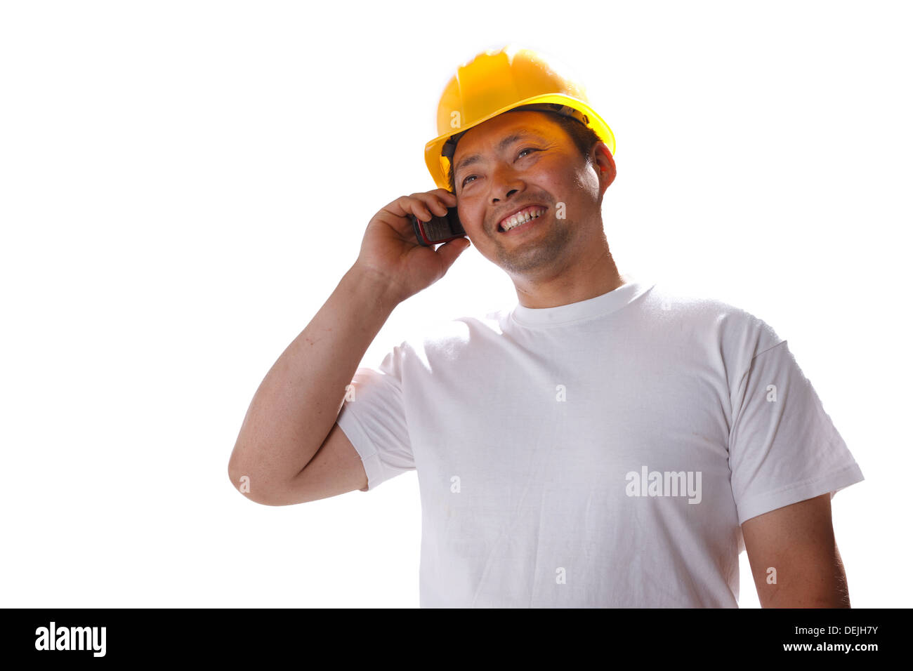 Building worker making phone call Stock Photo - Alamy
