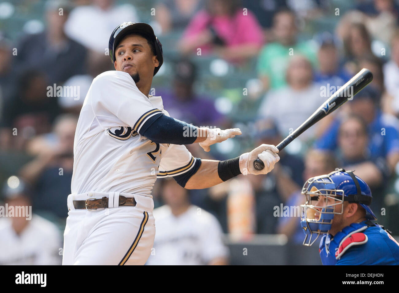 Milwaukee, Wisconsin, USA. 19th Sep, 2013. September 19th, 2013: Milwaukee Brewers center fielder Carlos Gomez #27 swings at a pitch spinning his helmet during the Major League Baseball game between the Milwaukee Brewers and the Chicago Cubs at Miller Park in Milwaukee, WI. John Fisher/CSM/Alamy Live News Stock Photo