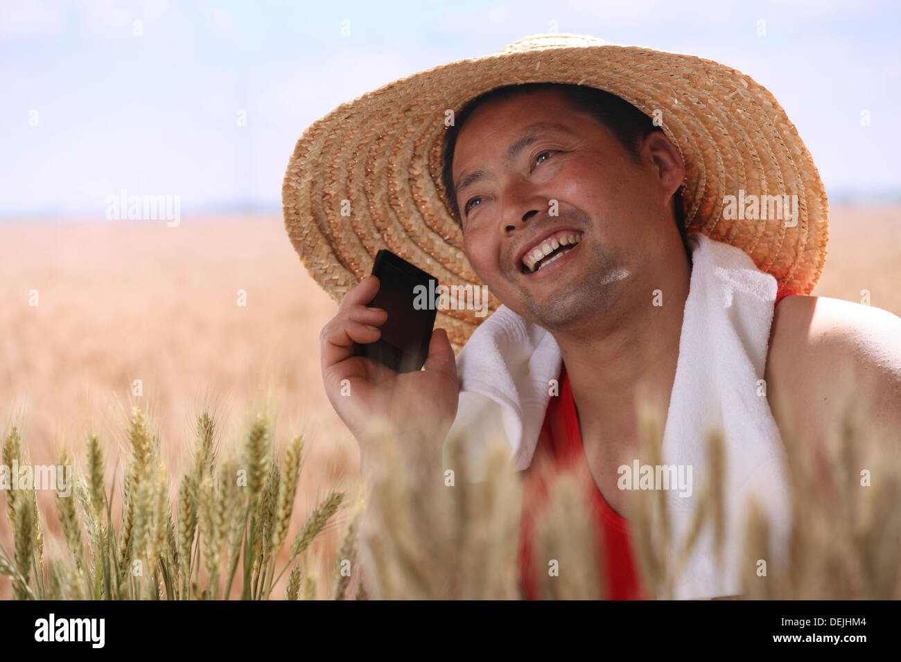 Farmer making phone call in wheat field Stock Photo Alamy