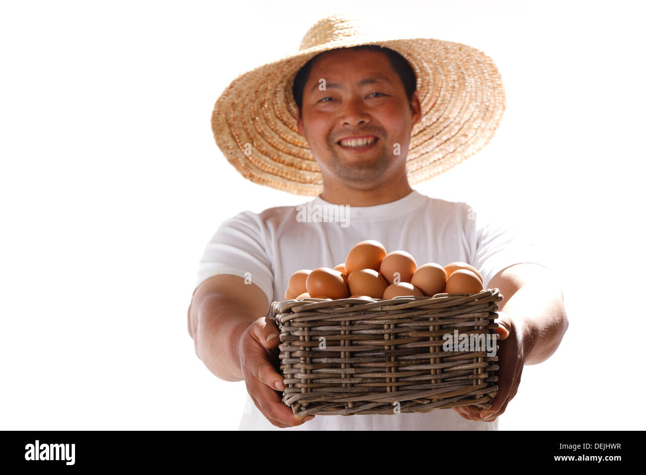 Farmer holding basket of vegetables Stock Photo - Alamy