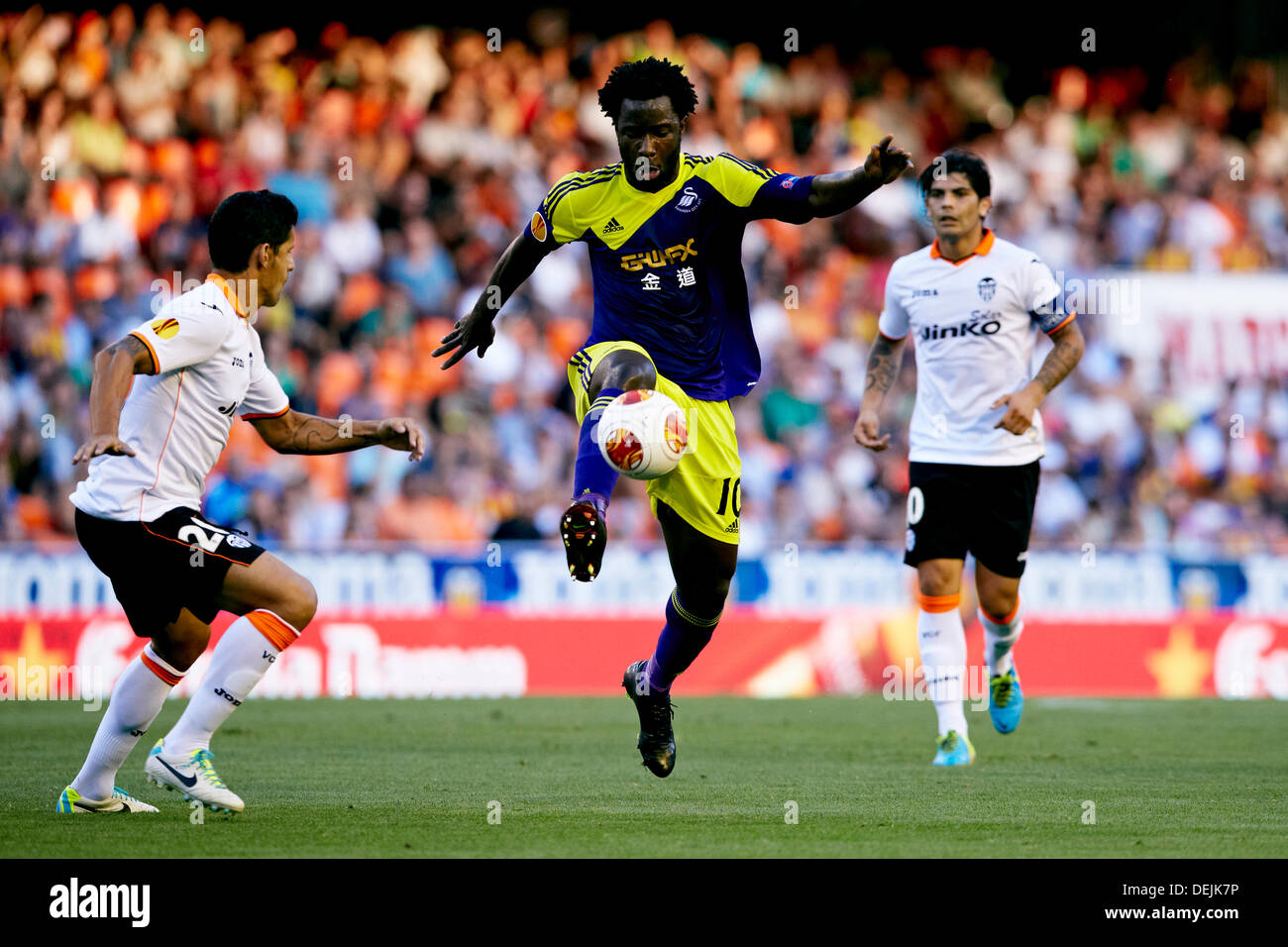 19.09.2013 Valencia, Spain. Forward Wilfried Bony of Swansea City (R) controls the ball in the presence of Defender Ricardo Costa of Valencia CF  during the Europa League game between Valencia and Swansea City from the Mestalla Stadium. Stock Photo