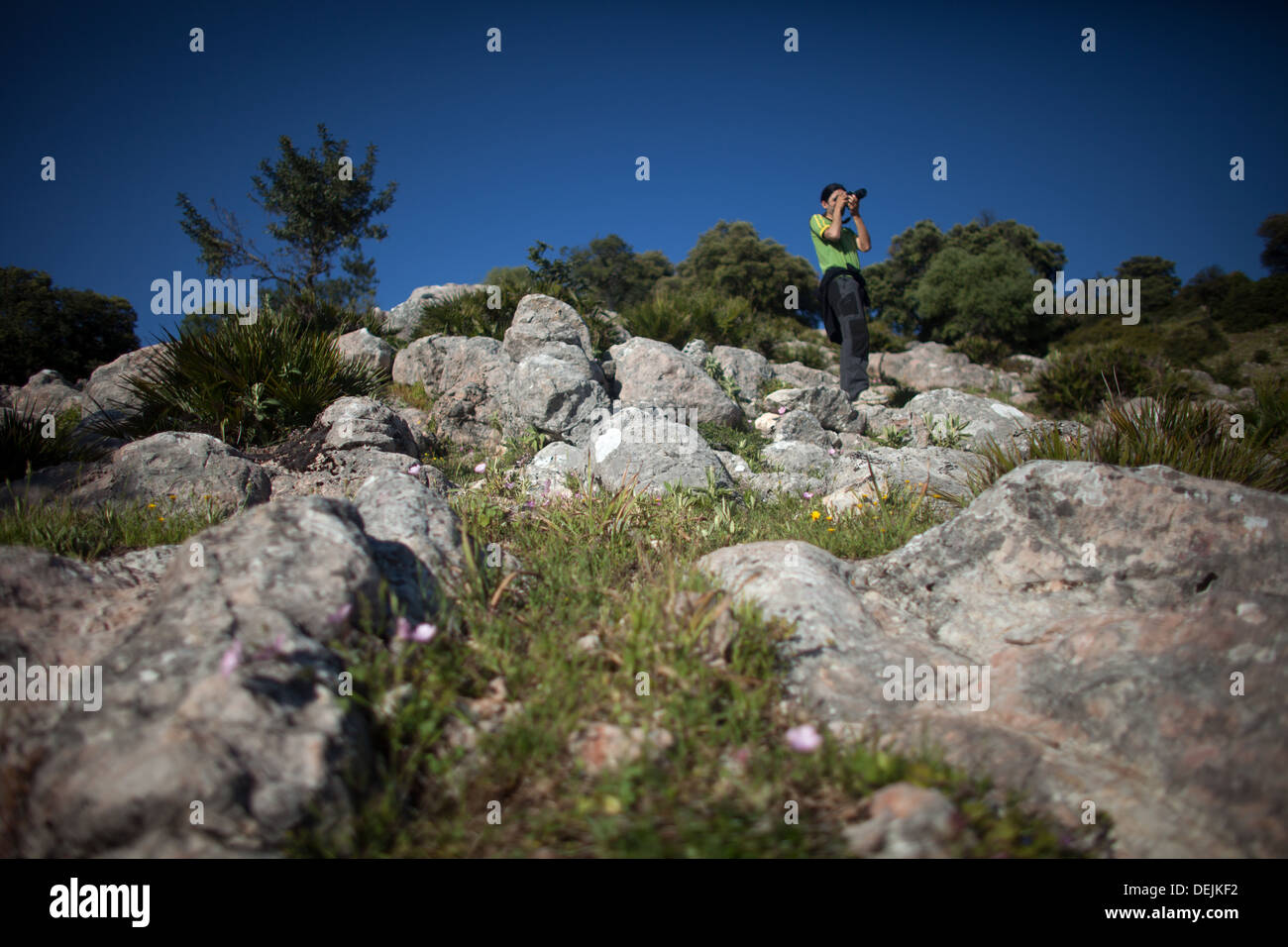 A tourist takes pictures in the Albarracin mountain, in the Sierra de