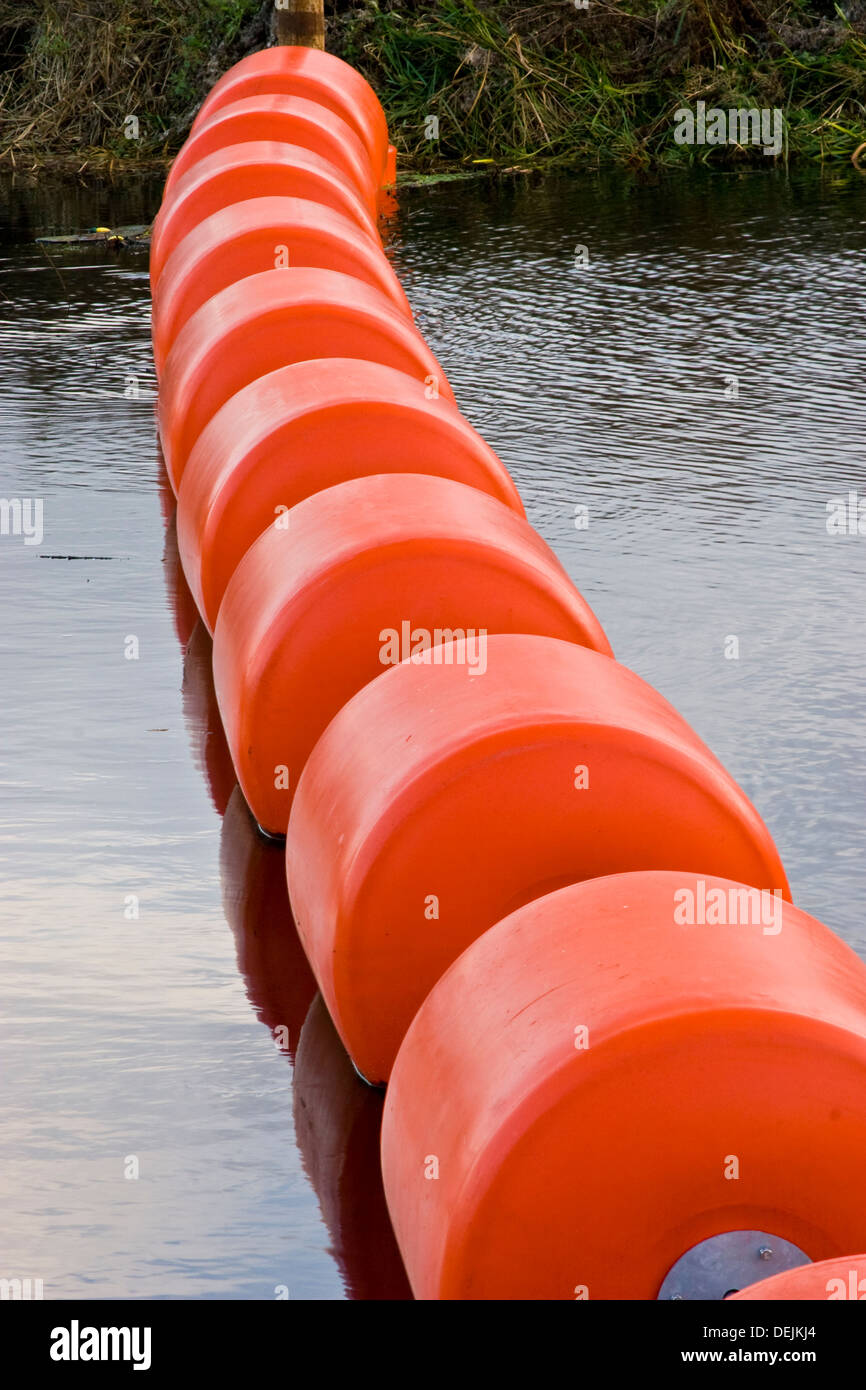 A floating boat barrier to prevent accidental access to the river weir