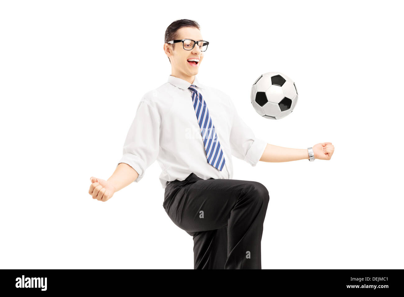 Young happy businessman playing with a soccer ball Stock Photo - Alamy
