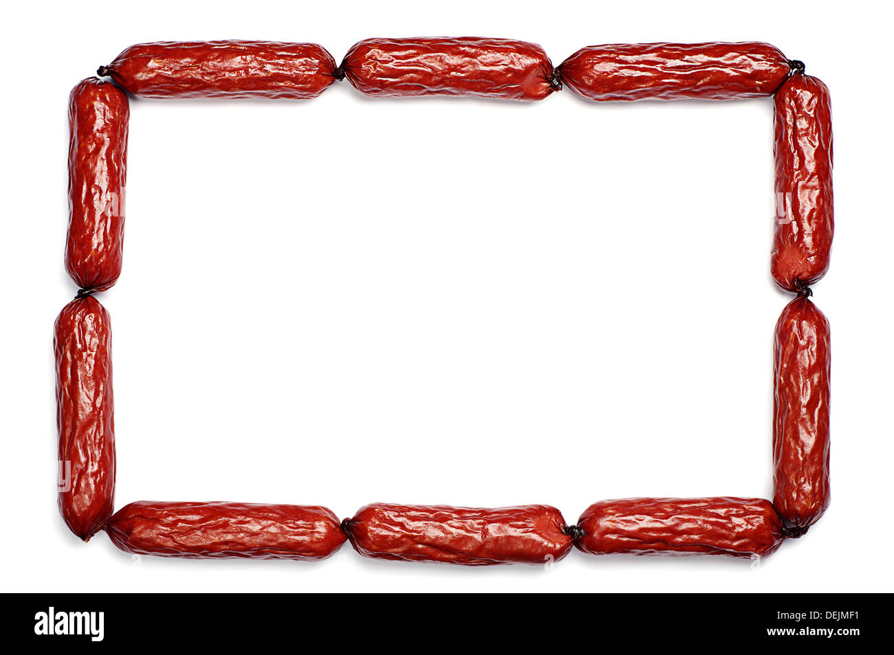 Frame of the small smoked sausages on a white background Stock Photo