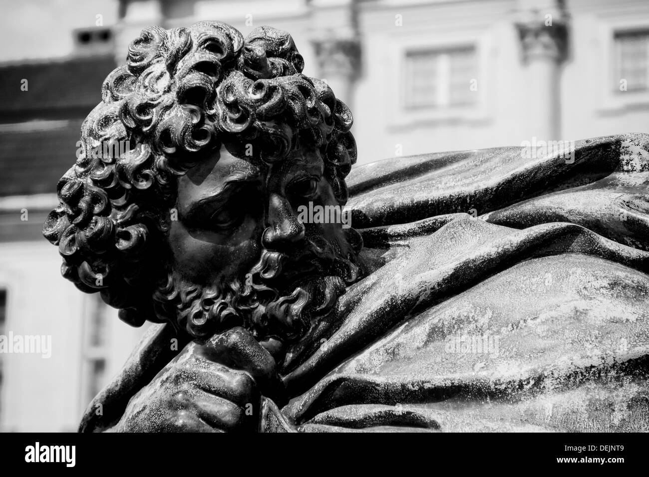 Fragment of old bronze sculpture. Head. Black and White Stock Photo