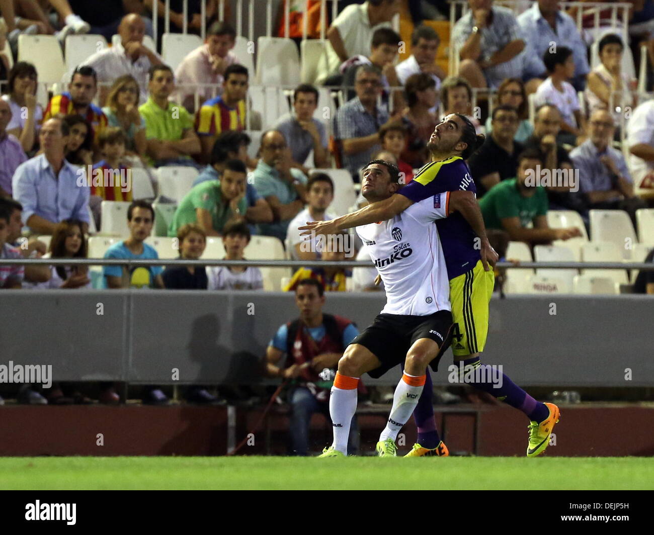 Valencia, Spain. Thursday 19 September 2013 Pictured L-R: Helder Postiga of Valencia challenged by Chico Flores of Swansea. Re: UEFA Europa League game against Valencia C.F v Swansea City FC, at the Estadio Mestalla, Spain, Credit:  D Legakis/Alamy Live News Stock Photo