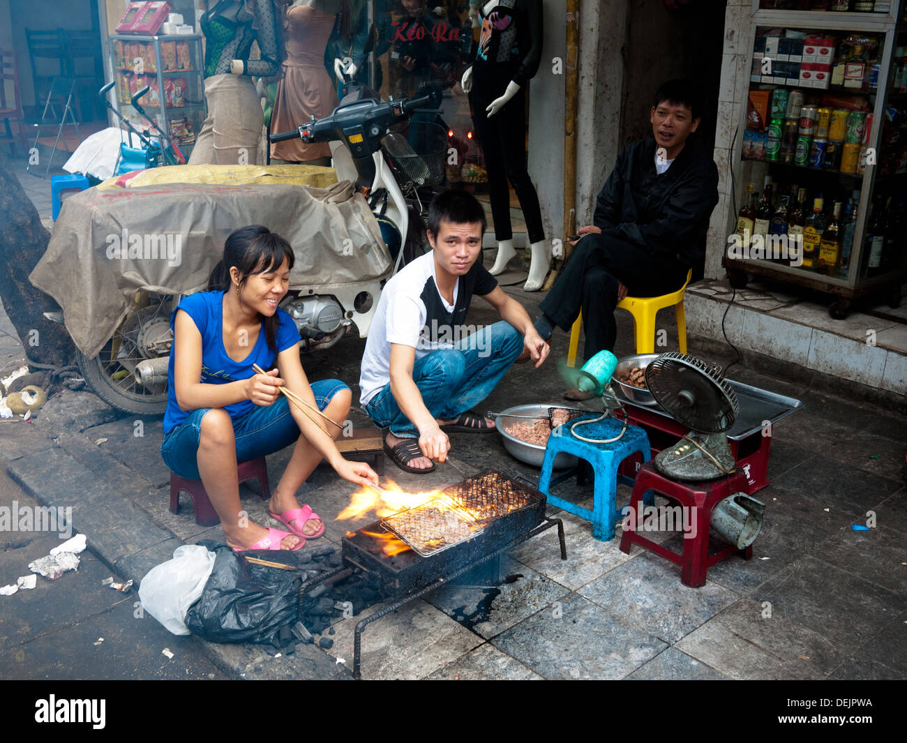 Roadside grilling and barbecue on the streets of Hanoi, Vietnam. Stock Photo