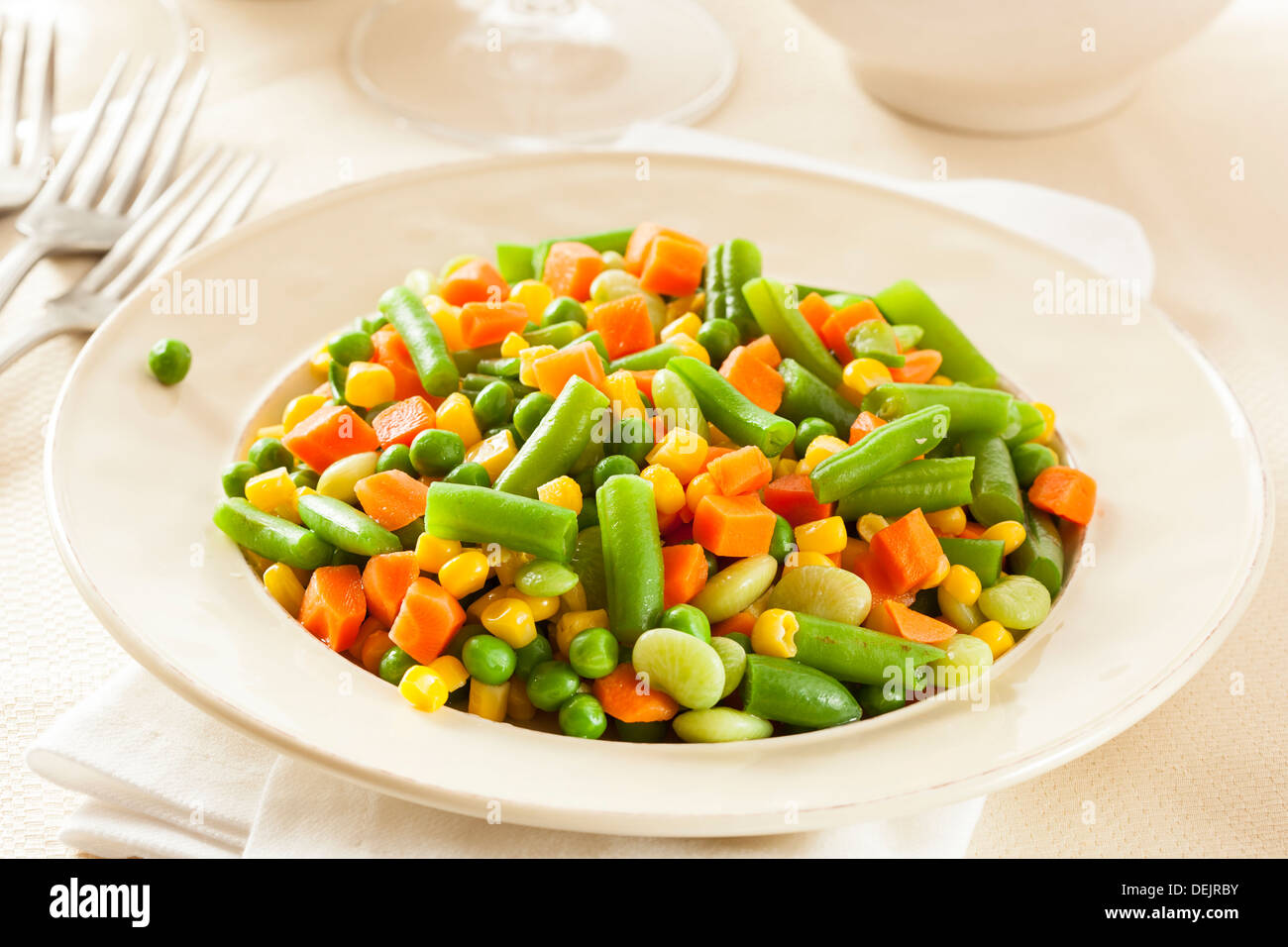 Steamed Organic Vegetable Medly with Peas, Corn, Beans, and Carrots Stock Photo