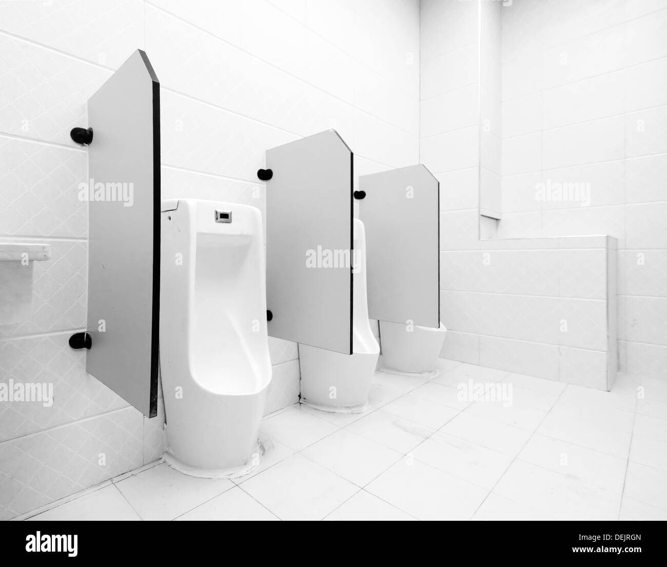 white porcelain urinals in public toilets Stock Photo Alamy