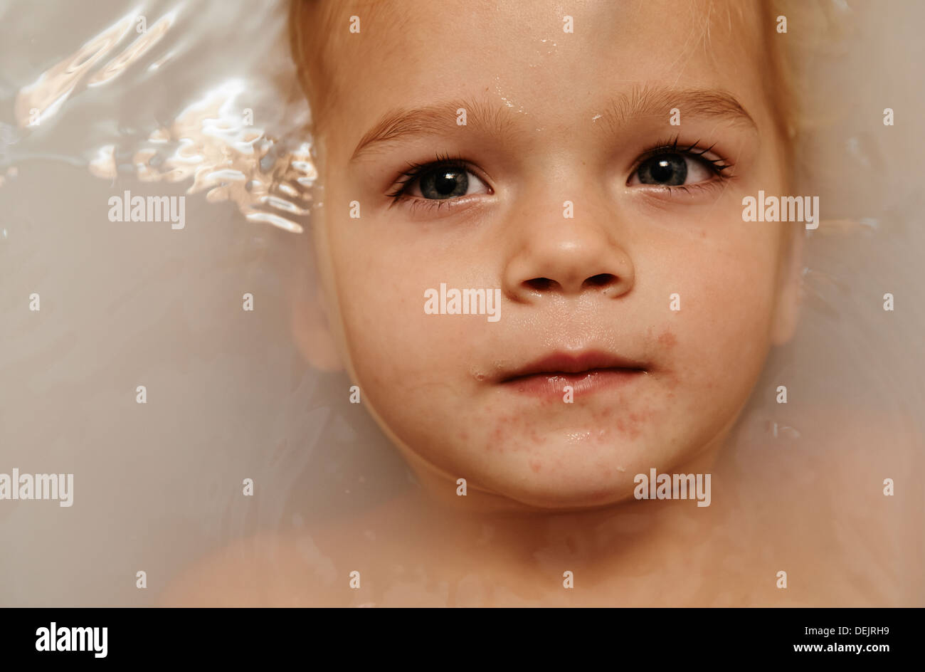 Portrait Of Child Baby Girl Partially Submerged In A Bath Stock Photo Alamy