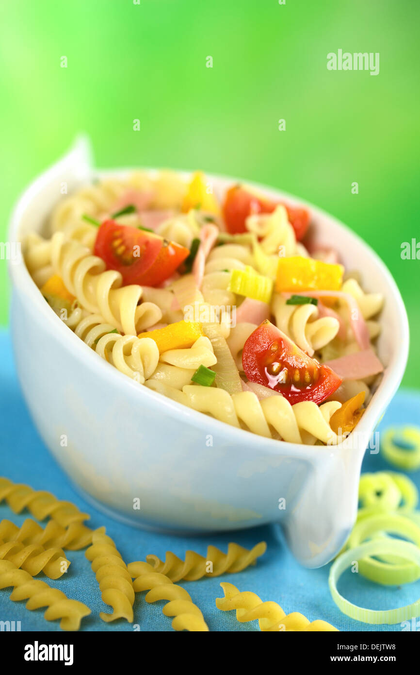 Pasta salad with leek, cherry tomato, yellow bell pepper and ham