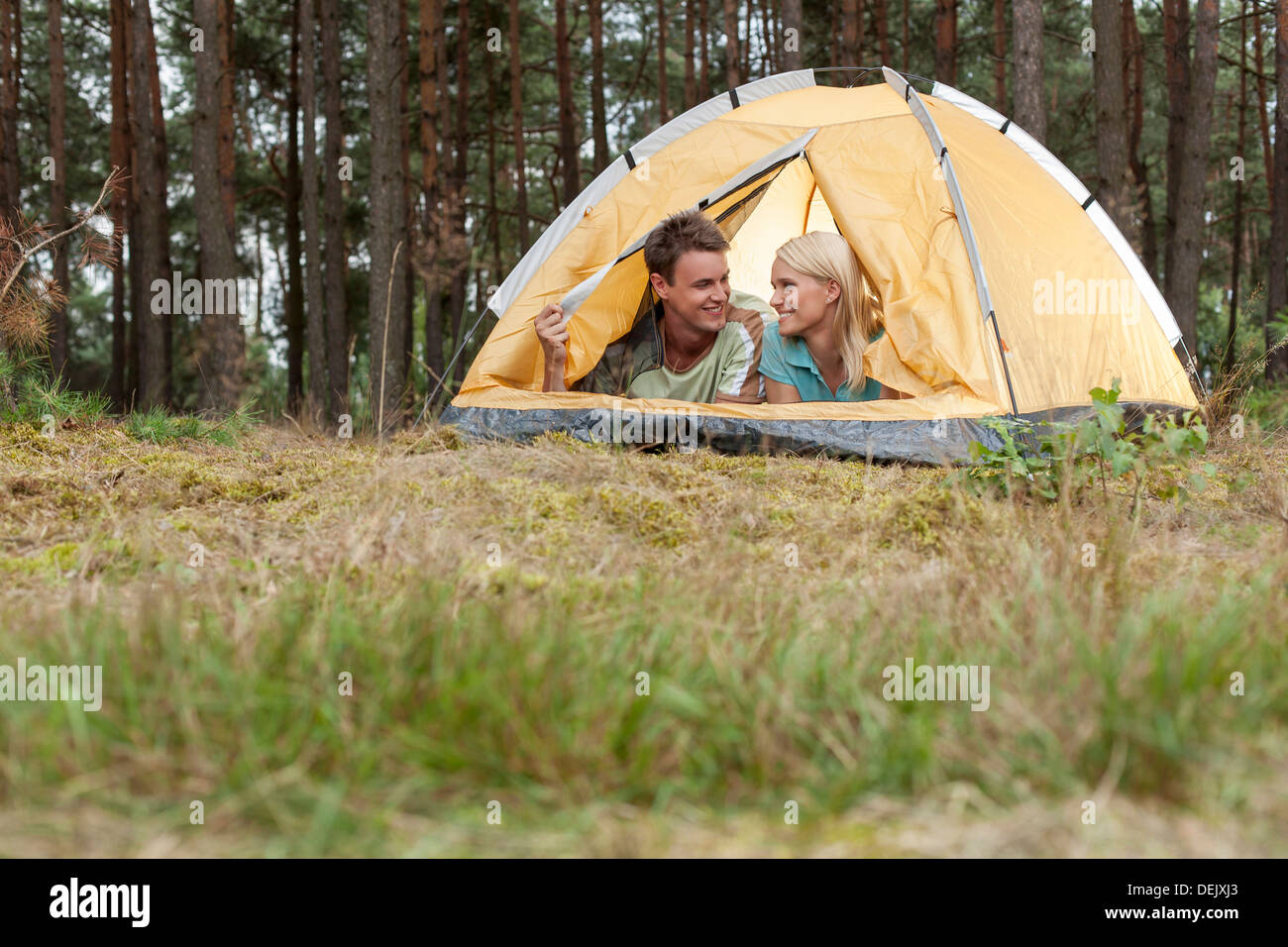 Loving young couple camping forest Stock Photo