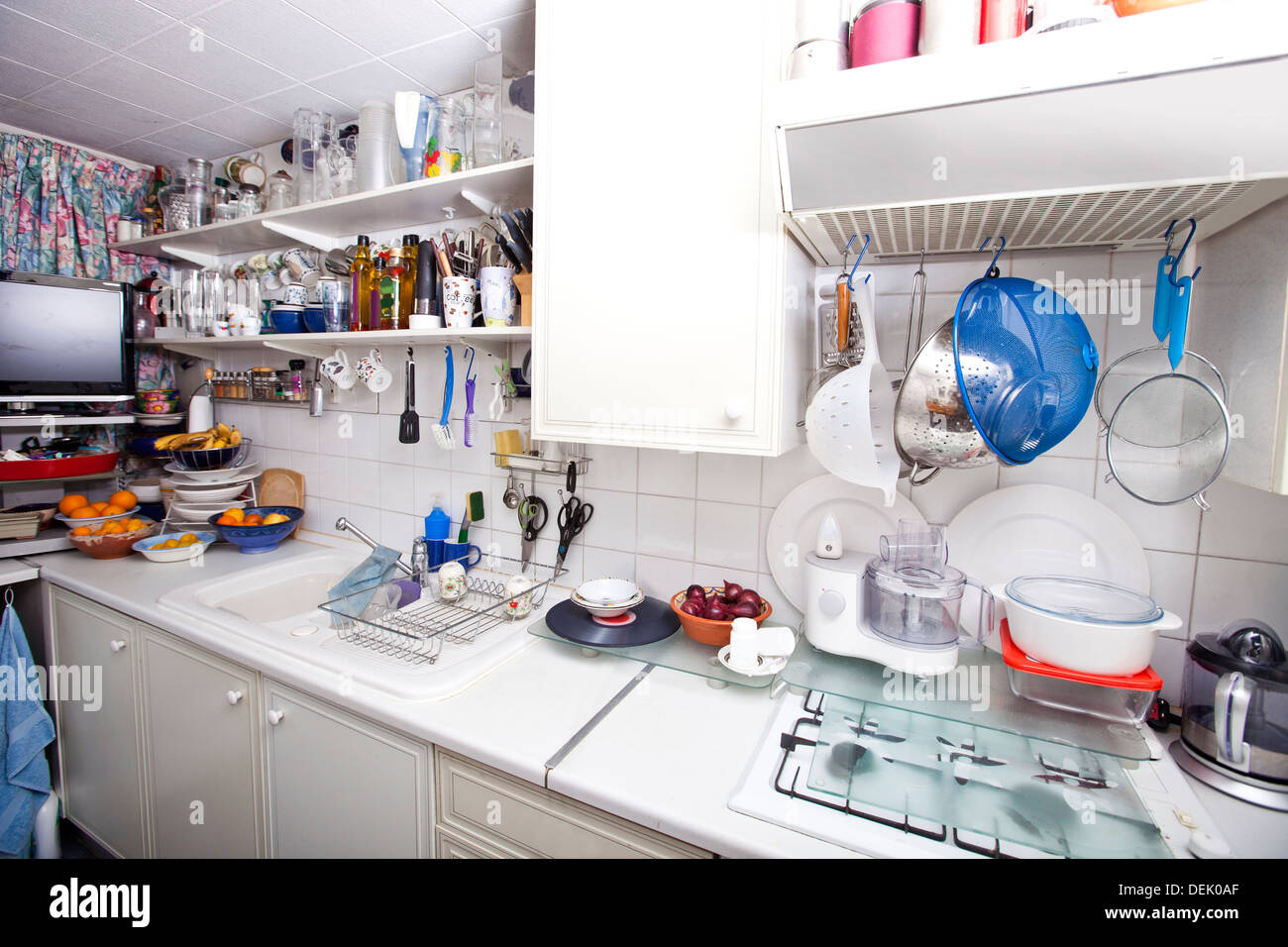 Interior domestic kitchen with utensils shelves Stock Photo