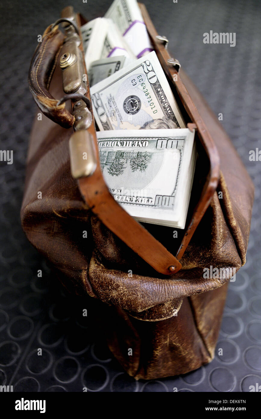 Leather bag with dollars Stock Photo Alamy