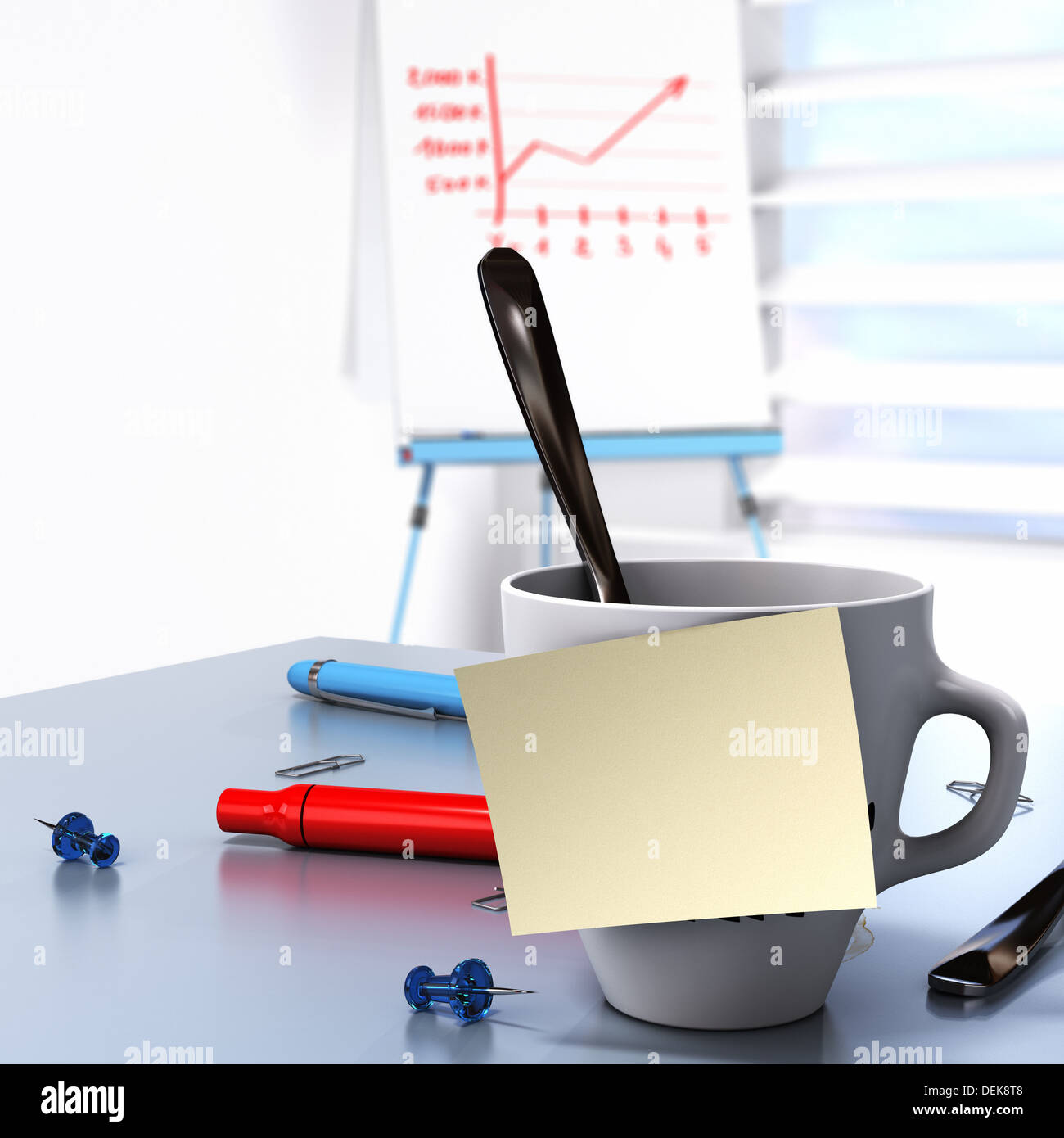 One mug with a blank yellow note fixed on it and a flipchart at the background conceptual image for Business communication Stock Photo