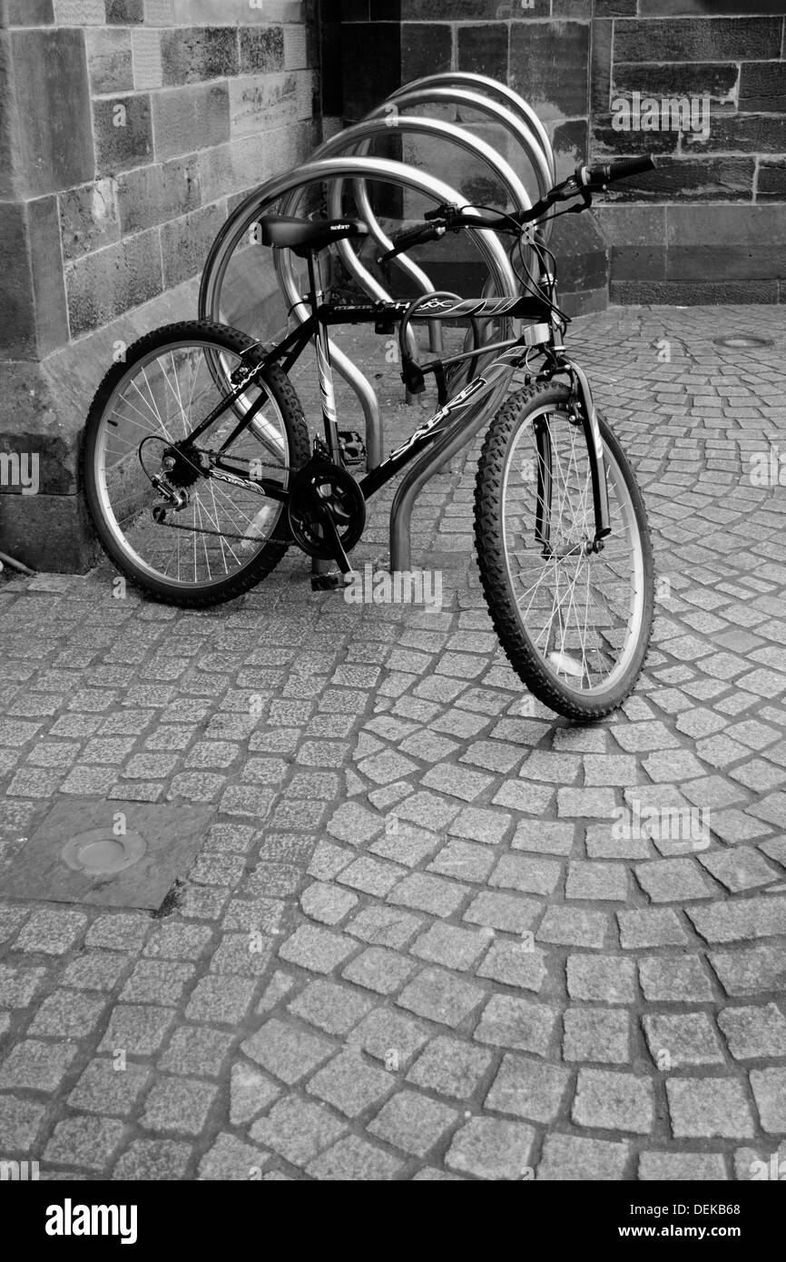 A vertical, black and white image of a bicycle rack on a cobbled street Stock Photo Alamy