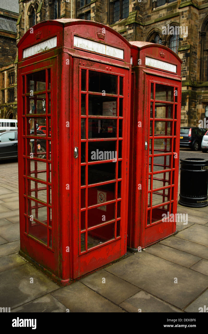A vertical, colour image of two red telephone boxes in Glasgow Stock Photo