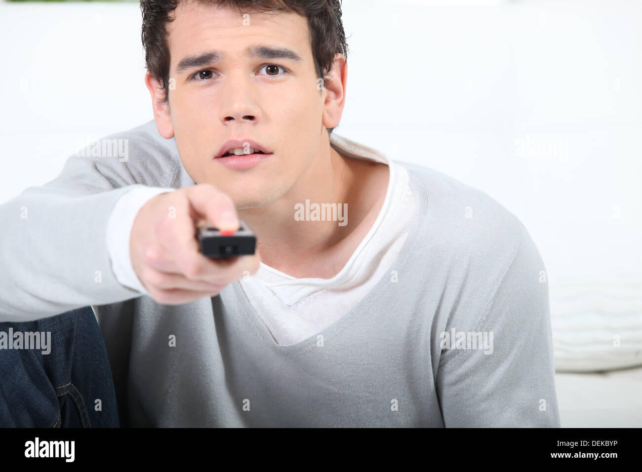 young man using a remote controller Stock Photo Alamy