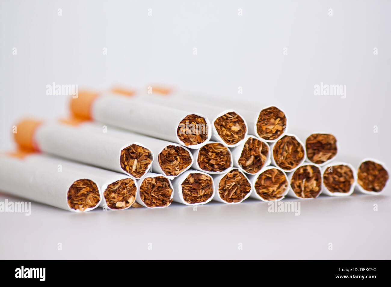 cigarettes on white paper Stock Photo Alamy