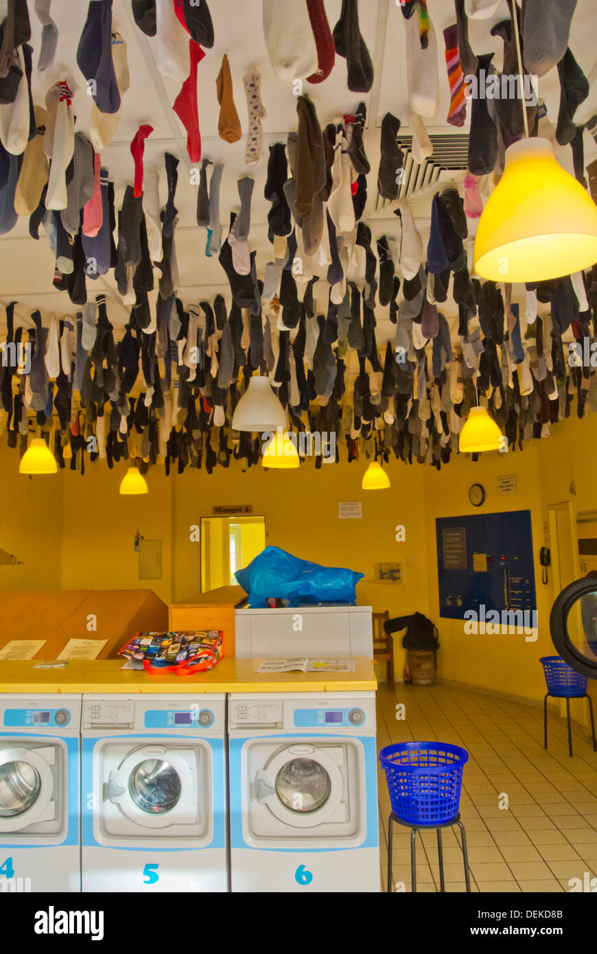 Laundrette with socks hanging from ceiling Neustadt the new town Dresden city Saxony state eastern Germany central Europe Stock Photo