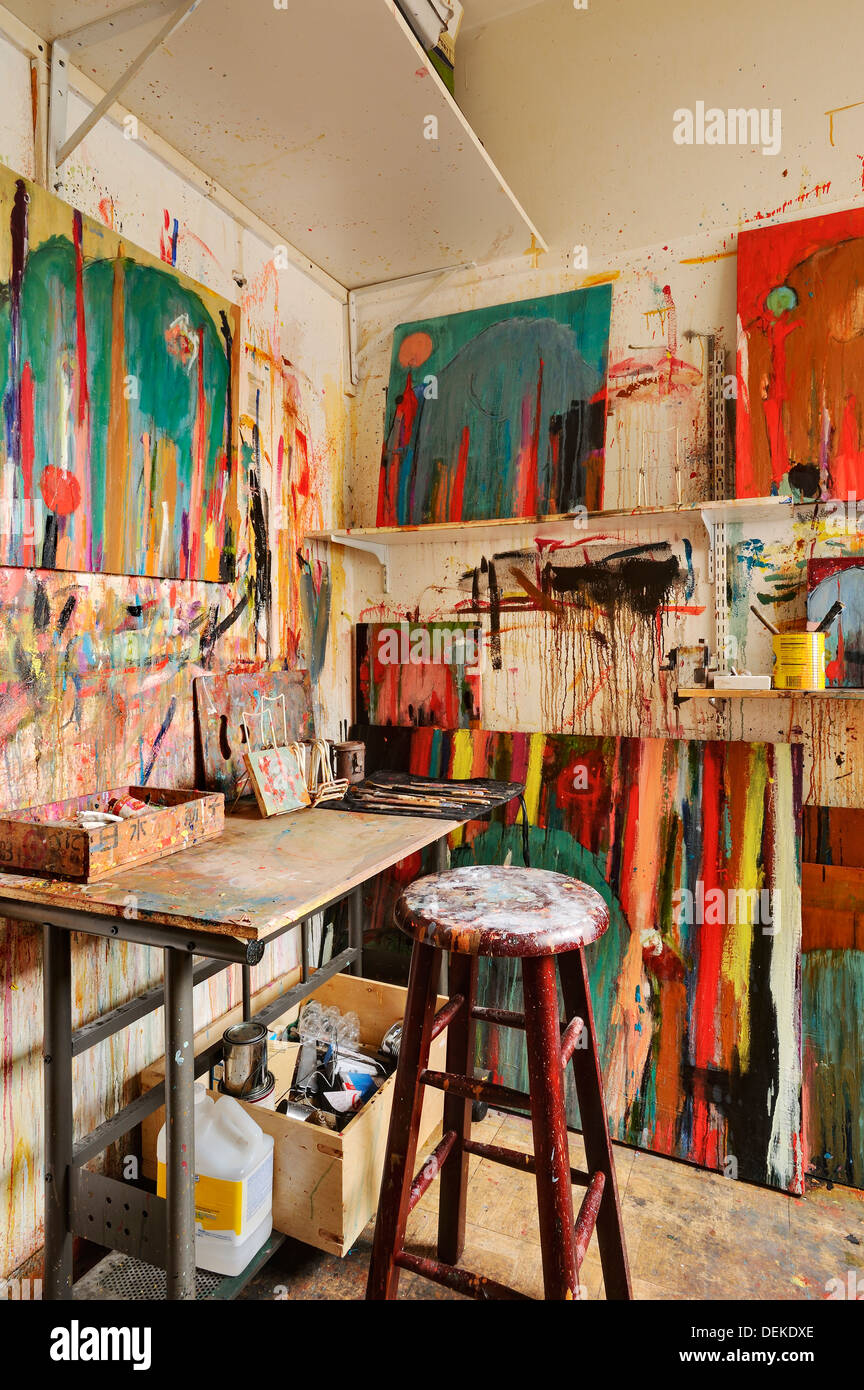 Paint splattered walls of art studio Stock Photo