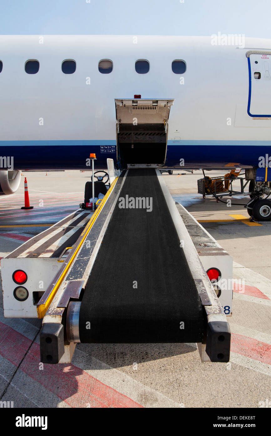 Conveyor belt by airplane cargo hold Stock Photo - Alamy