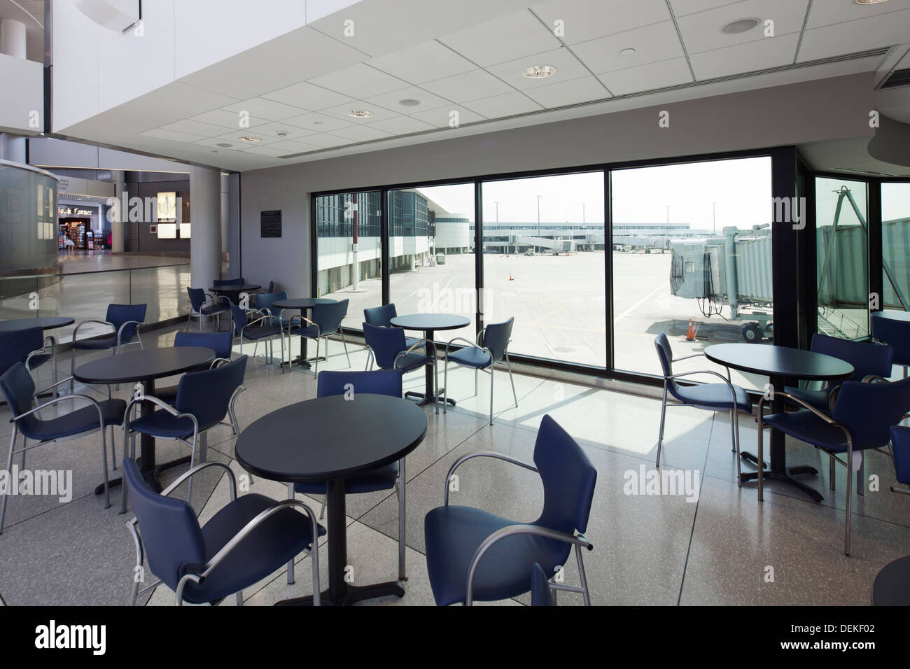 Empty cafe overlooking runway in airport Stock Photo