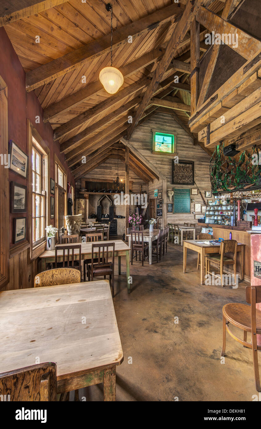 Empty chairs and tables in restaurant Stock Photo