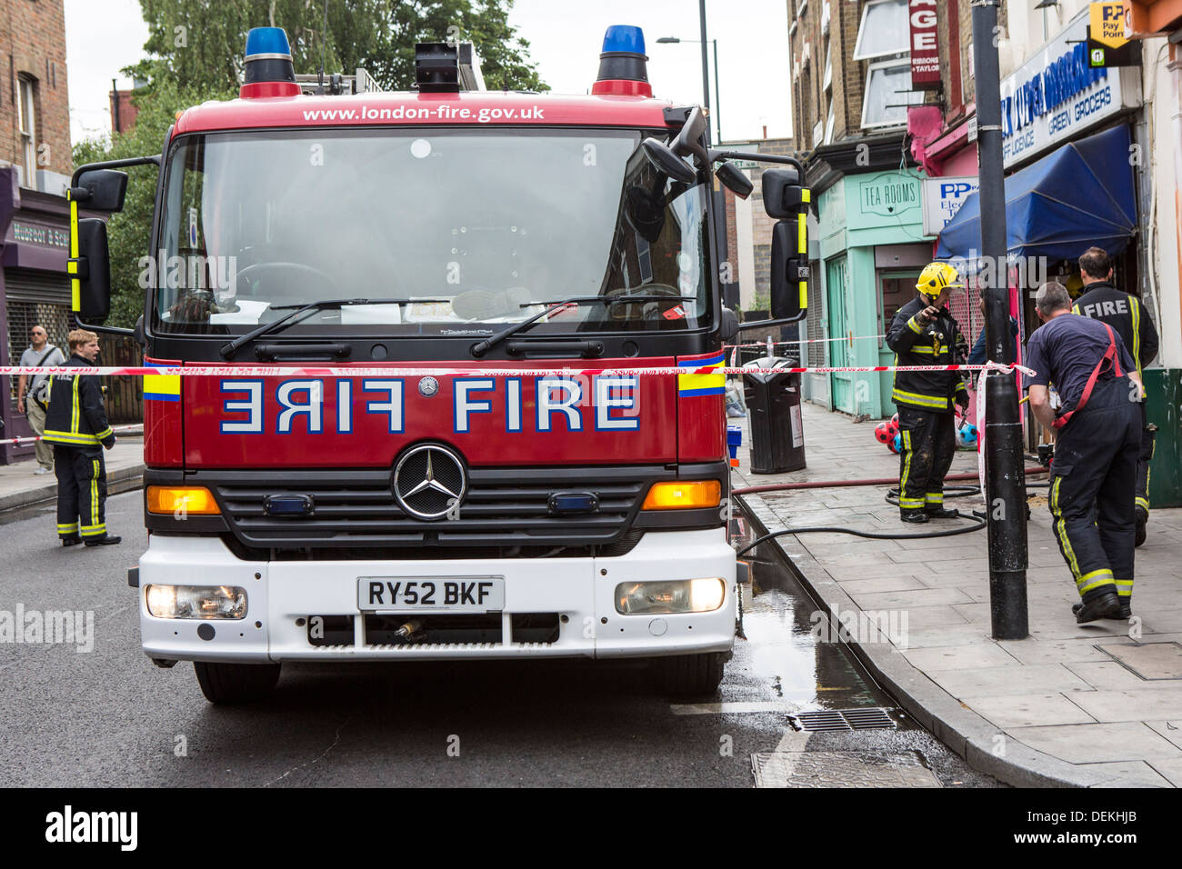 Emergency services Firefighters from the London Fire Brigade respond to an emergency in Stoke Newington, London. Stock Photo