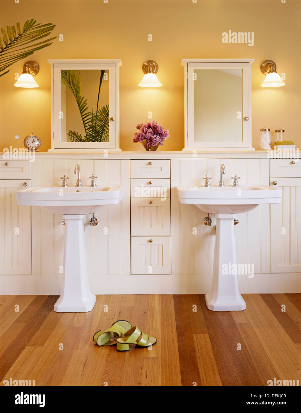 Shoes And Pedestal Sinks In Luxury Bathroom Stock Photo