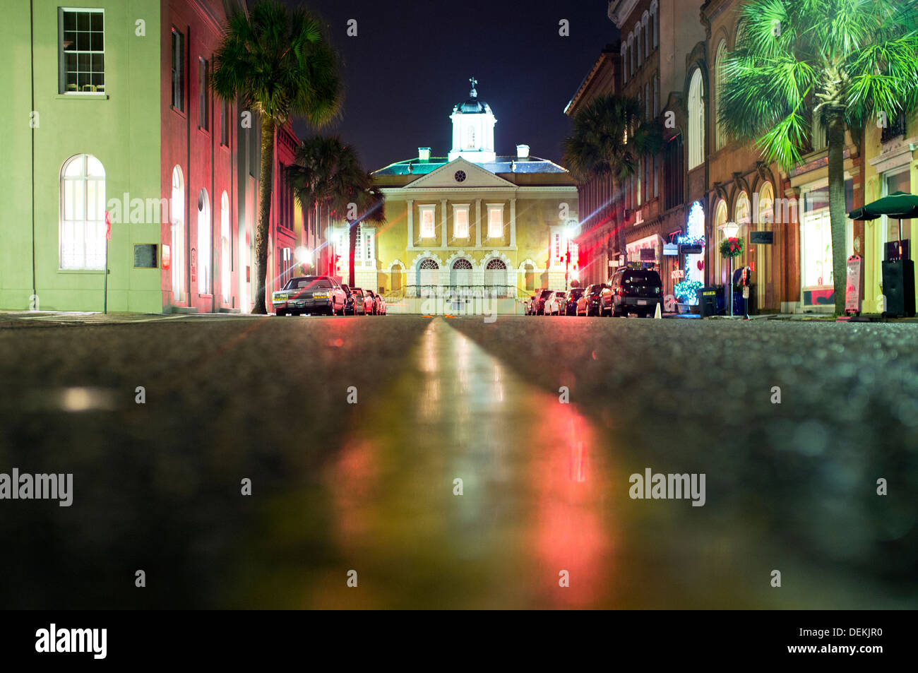 Illuminated buildings along city street at night, Charleston, South Carolina, United States