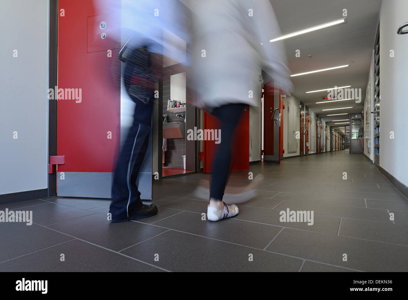 Ravensburg, Germany. 19th Sep, 2013. A female inmate and an employee of the prison walk through the new build in the prison of Ravensburg, Germany, 19 September 2013. Photo: Felix Kaestle/dpa/Alamy Live News Stock Photo