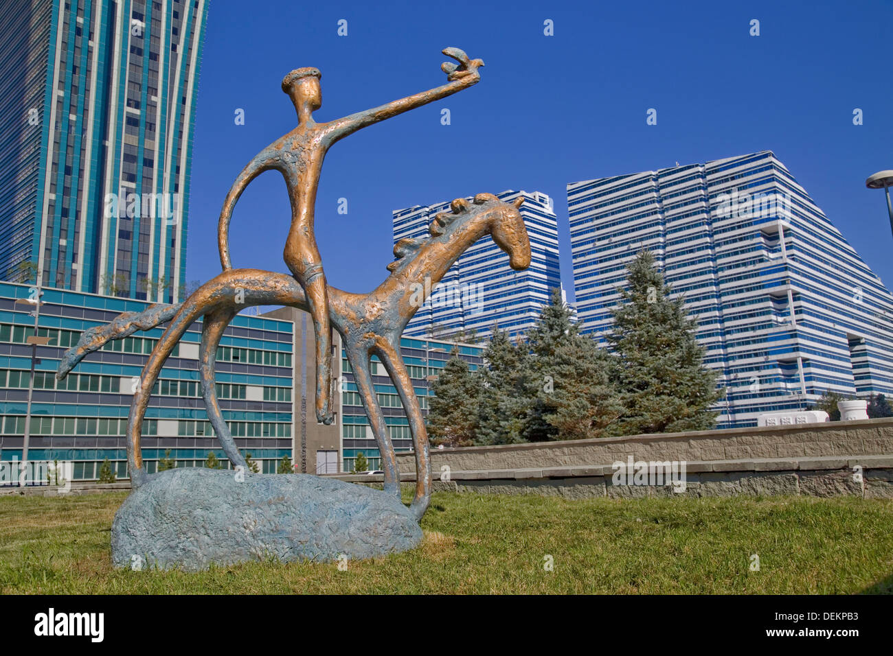 Sculpture and Astana modern buildings, Kazakhstan Stock Photo