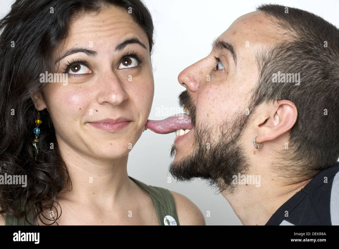 Young newlywed husband liking her wife on the cheek Stock Photo image