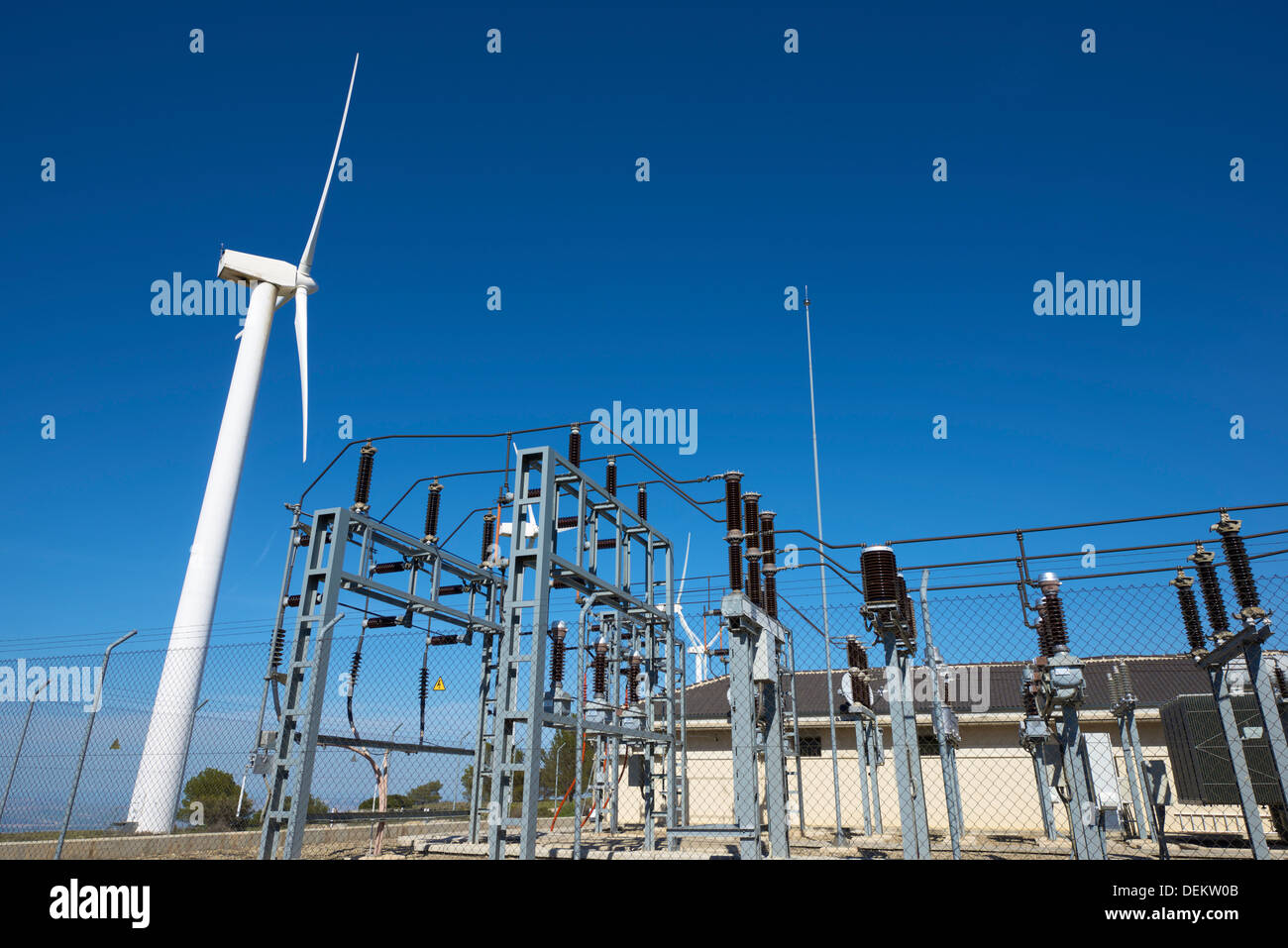 windmills for removable energy production and electrical substation, El Buste, Zaragoza, Aragon, Spain Stock Photo
