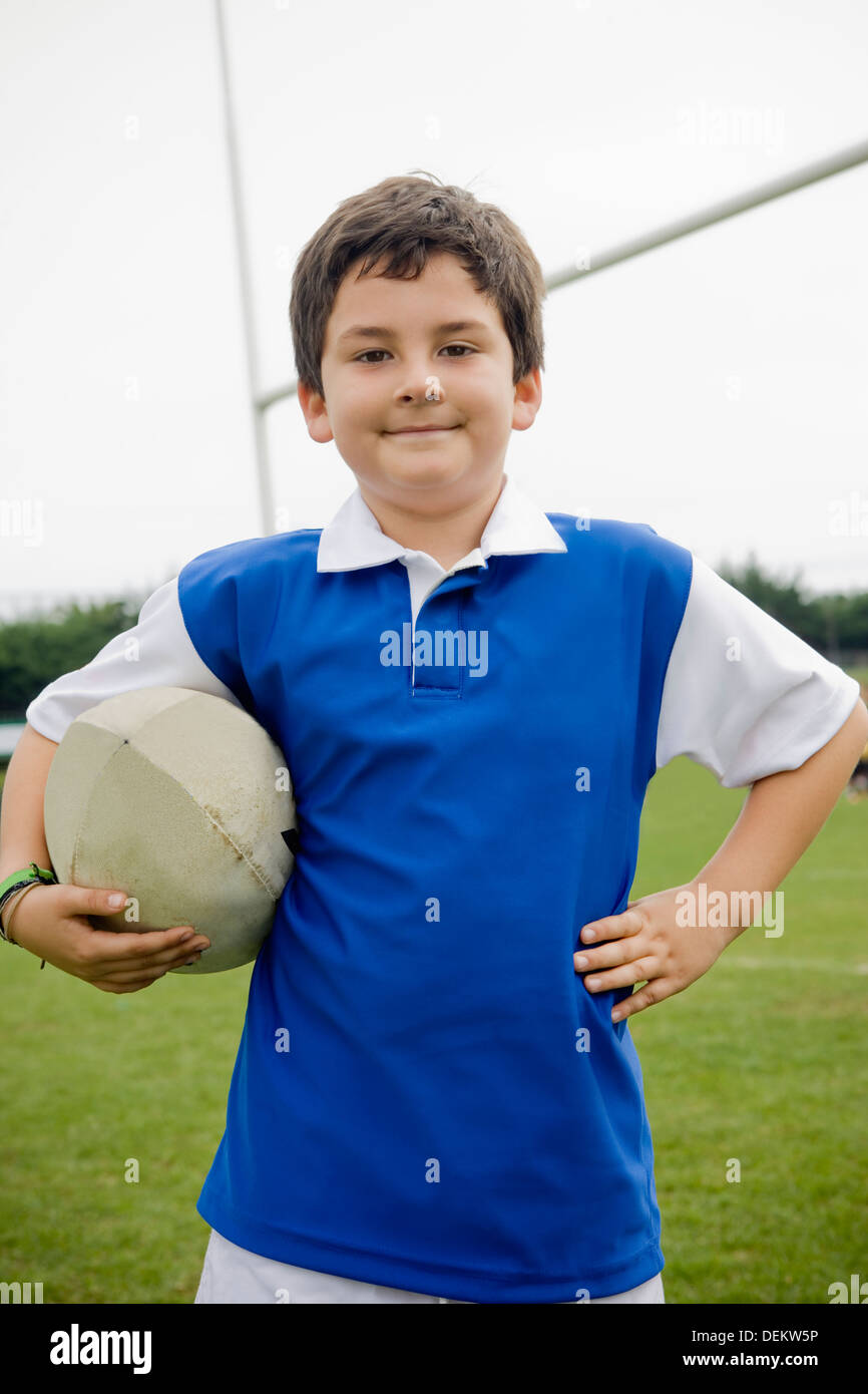 Boy holding rugby ball hires stock photography and images Alamy