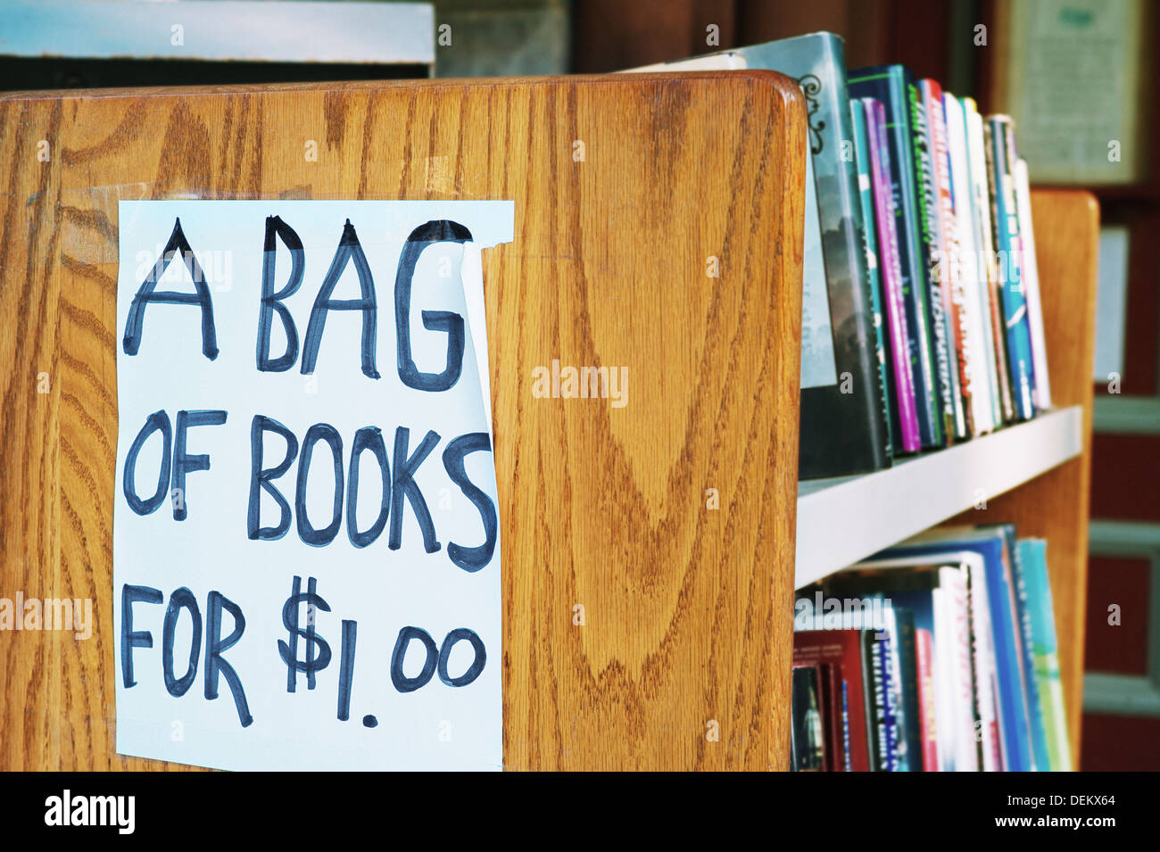 A bag of books for $1.00 sign in library Stock Photo - Alamy