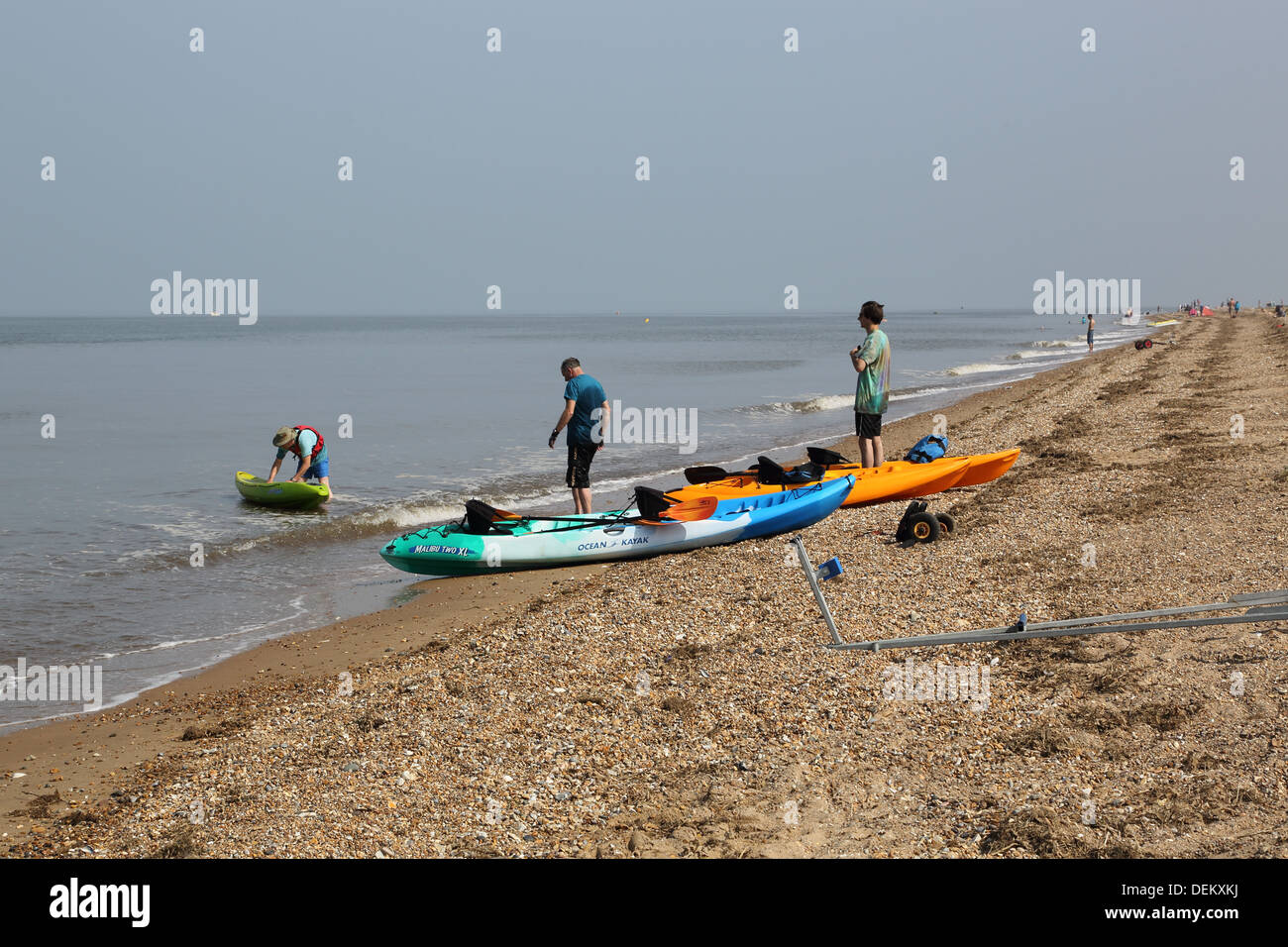 sea kayaks at on the norfolk coast Stock Photo Alamy
